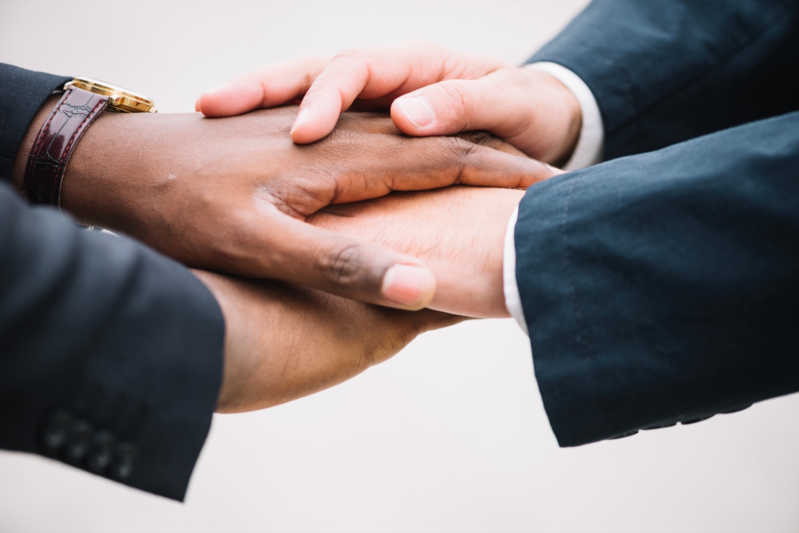 Colleagues joining hands