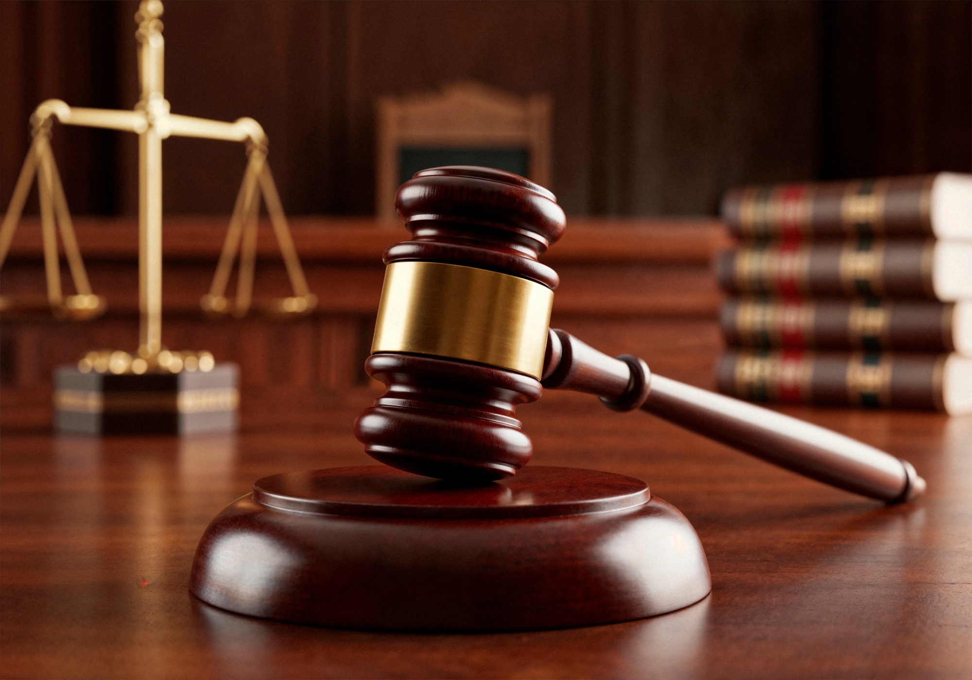 A judge's gavel beside the scales of justice